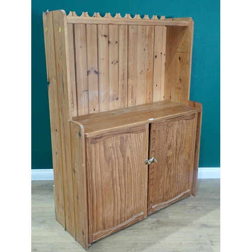 477 - A pine Cupboard with raised back fitted two doors to base 5ft H x 3ft 9in W