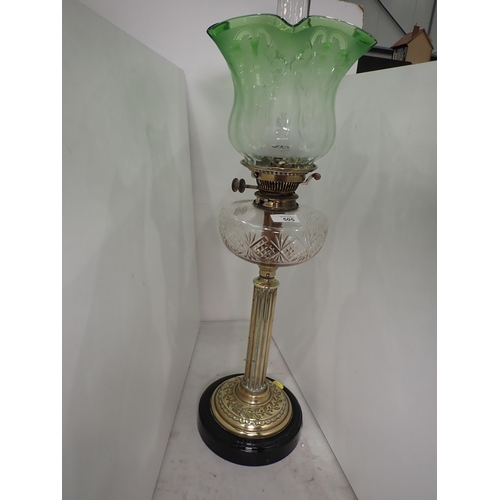 505 - A brass Paraffin Lamp with etched green glass shade and clear glass reservoir, 26in H