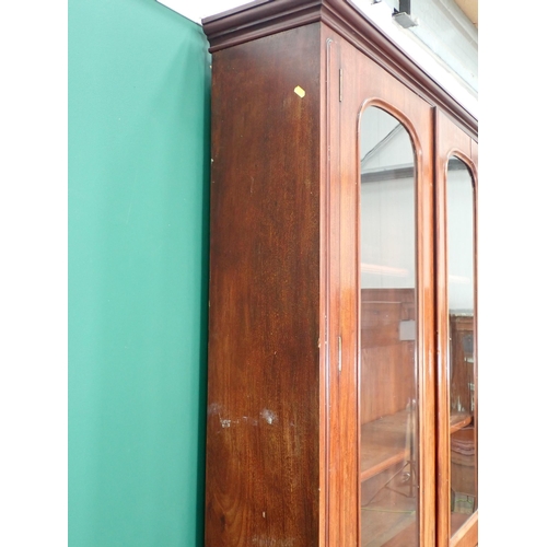 594 - A Victorian mahogany Secretaire Bookcase fitted pair of arched glazed doors above base fitted four d... 