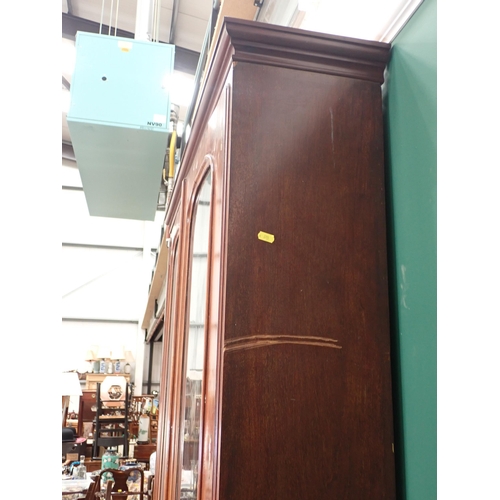 594 - A Victorian mahogany Secretaire Bookcase fitted pair of arched glazed doors above base fitted four d... 