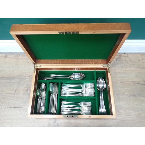 607 - An oak cased Canteen of plated cutlery bearing engraved cartouche