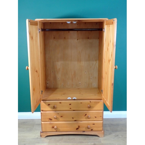 61 - A modern pine Wardrobe fitted two drawers to base 5ft H x 2ft 10in W