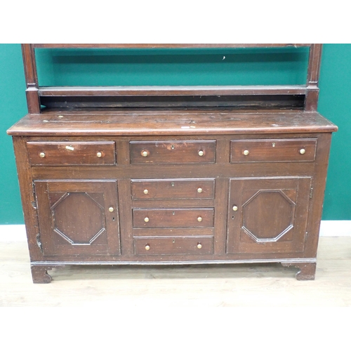 625 - An 18th Century oak enclosed Dresser and open Rack the base fitted six drawers and pair of cupboard ... 