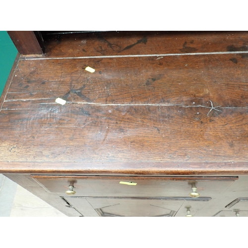 625 - An 18th Century oak enclosed Dresser and open Rack the base fitted six drawers and pair of cupboard ... 