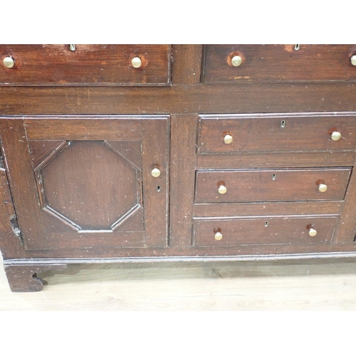 625 - An 18th Century oak enclosed Dresser and open Rack the base fitted six drawers and pair of cupboard ... 