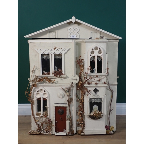 63 - A white painted Doll's House with a quantity of furniture 2ft 10in H x 2ft 3in W