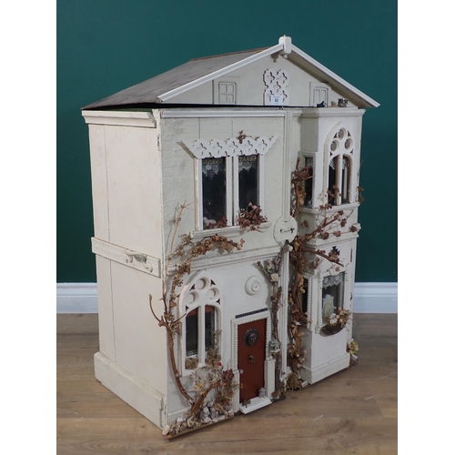 63 - A white painted Doll's House with a quantity of furniture 2ft 10in H x 2ft 3in W