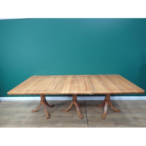 657 - A modern cherry wood and strung triple pedestal Dining Table, including two leaves, 7ft 11in L x 2ft... 