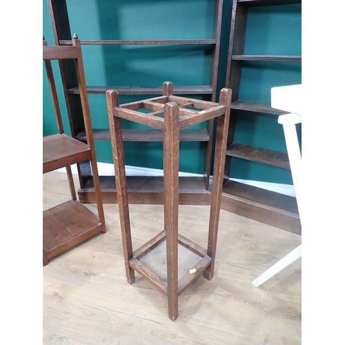 676 - A mahogany three tier Stand, an oak Stick Stand, white Butler's Tray and two oak Bookcases