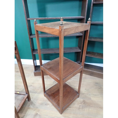 676 - A mahogany three tier Stand, an oak Stick Stand, white Butler's Tray and two oak Bookcases