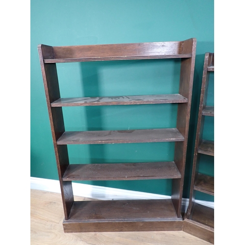 676 - A mahogany three tier Stand, an oak Stick Stand, white Butler's Tray and two oak Bookcases