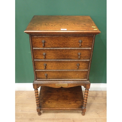 703 - A 20th Century oak Music Chest fitted four drawers with bobbin moulding mounted upon bobbin turned s... 