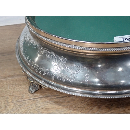 708 - A silver plated Cake Stand with mirrored top, beaded borders on scrolled supports 16