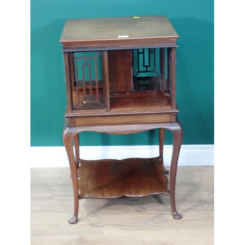 712 - A Victorian mahogany revolving Bookcase on cabriole supports 2ft 7in H x 1ft 6in W