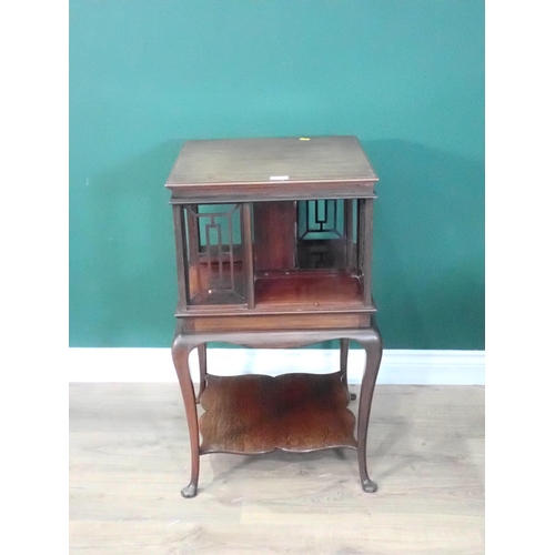 712 - A Victorian mahogany revolving Bookcase on cabriole supports 2ft 7in H x 1ft 6in W