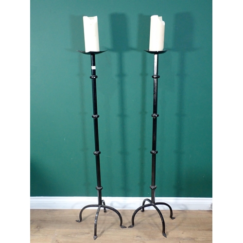 715 - A pair of floor standing metal pricket Candle Stands 4ft 6in H