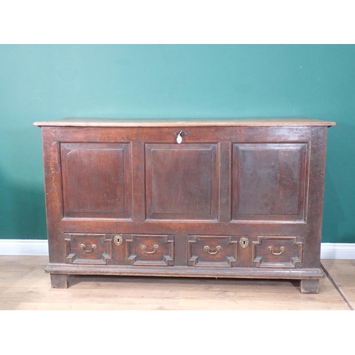 718 - An early 18th Century oak Mule Chest with fielded three panel front above two moulded drawers 5ft 1i... 