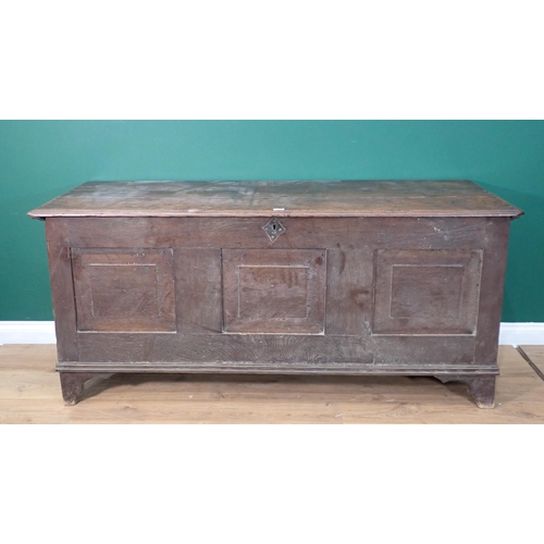 719 - An 18th Century oak Coffer with fielded three panel front mounted on bracket feet 5ft 9in W x 2ft 7i... 