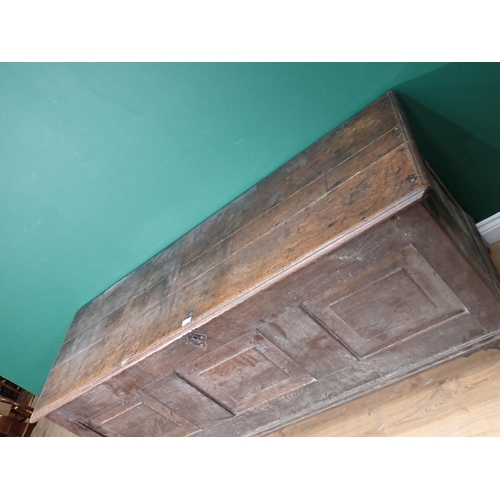 719 - An 18th Century oak Coffer with fielded three panel front mounted on bracket feet 5ft 9in W x 2ft 7i... 