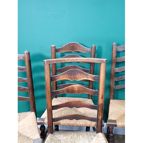 727 - A set of five antique rush seated ladderback Chair, viz; one carver and five singles