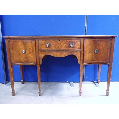 728 - An Edwardian mahogany serpentine Sideboard, fitted cupboards and drawers, on squared supports and sp... 