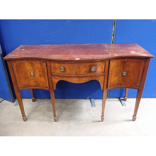 728 - An Edwardian mahogany serpentine Sideboard, fitted cupboards and drawers, on squared supports and sp... 