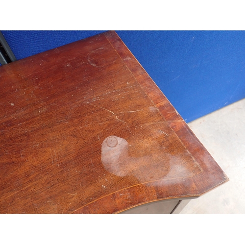 728 - An Edwardian mahogany serpentine Sideboard, fitted cupboards and drawers, on squared supports and sp... 