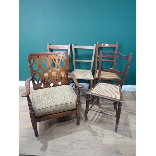 769 - A low upholstered Armchair and four cane seated Bedroom Chairs