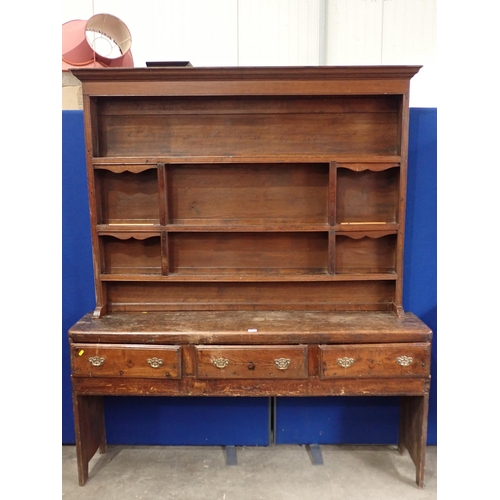 771 - An antique oak Dresser and associated Rack, the base fitted three drawers with plank end supports, 6... 