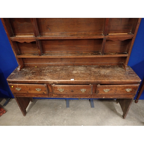 771 - An antique oak Dresser and associated Rack, the base fitted three drawers with plank end supports, 6... 