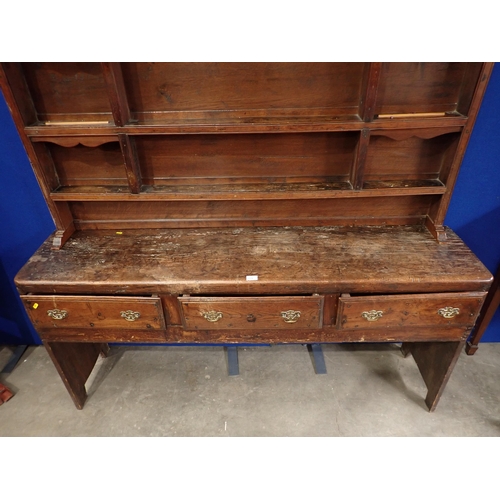 771 - An antique oak Dresser and associated Rack, the base fitted three drawers with plank end supports, 6... 