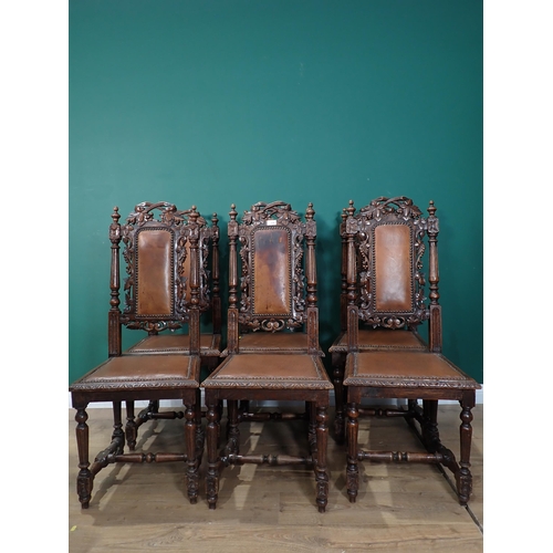 775 - A set of six Victorian carved oak Dining Chairs with fluted turned supports.