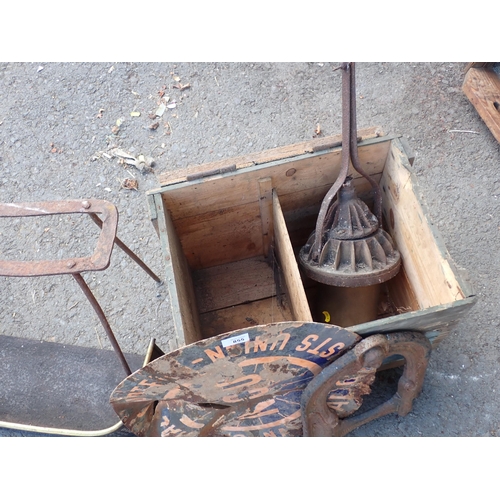 855 - A wooden Crate, NCO enamel Sign A/F, cast iron Boot Scrape, antique iron Footman and a Fender