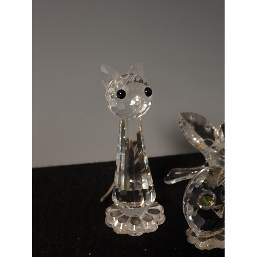 213 - A Collection of Swarovski animals including a Swan, Pig, Mouse, Fish, Duck, Cat, Dog, etc.