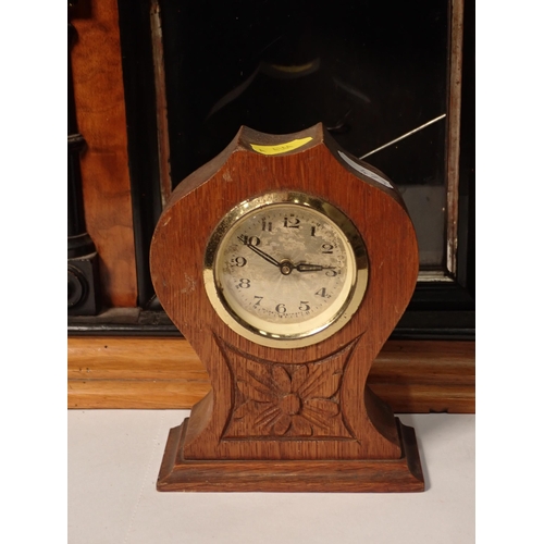 471 - A Victorian walnut and ebonised Mantle Clock and an oak Mantle Clock