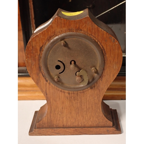 471 - A Victorian walnut and ebonised Mantle Clock and an oak Mantle Clock