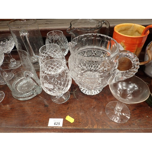 673 - A collection of glassware including cranberry Brandy Balloons, Champagne, Water Jug, a pair of delft... 