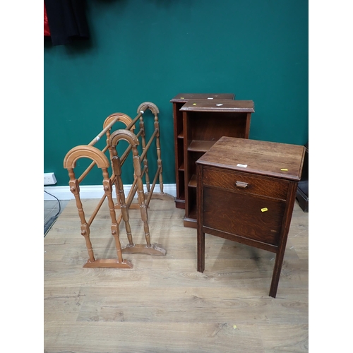 698 - An oak Bedside Stand, a pair of small modern Bookcases and two Towel Rails