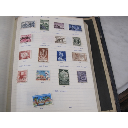 403 - A collection in three blue Stamp Albums and a green Strand album containing a mint/used All World se... 