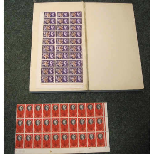 438 - G.B. Que II Stamps: A Folio containing a selection of mint blocks, comprising Que II definitives ½d;... 