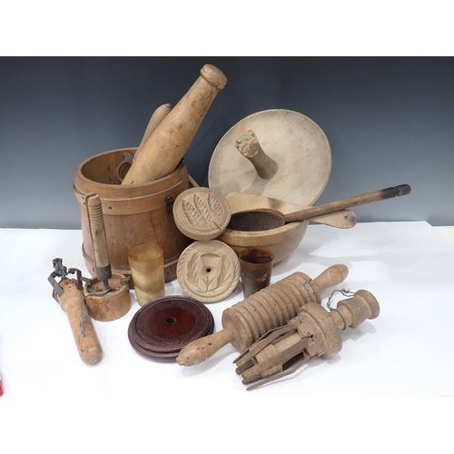 694 - A collection of wooden Kitchen items including butter press, Knives, Rolling Pin, etc.