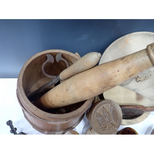 694 - A collection of wooden Kitchen items including butter press, Knives, Rolling Pin, etc.