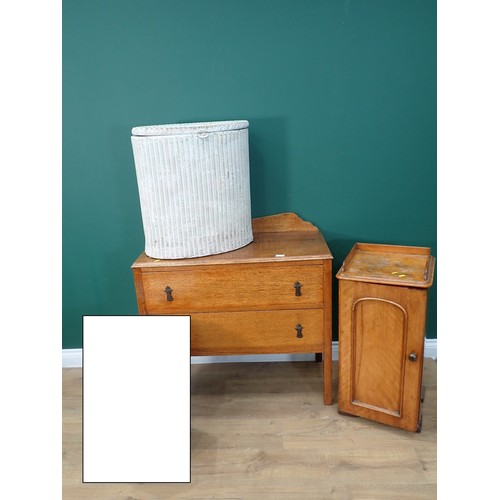 691 - A Victorian satin birch Pot Cupboard, an oak Chest of drawers, an oval Wall Mirror and a Lloyd Loom ... 