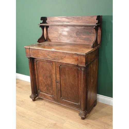 13 - A 19th Century mahogany Chiffonier with raised gallery back fitted two doors between columns on turn... 