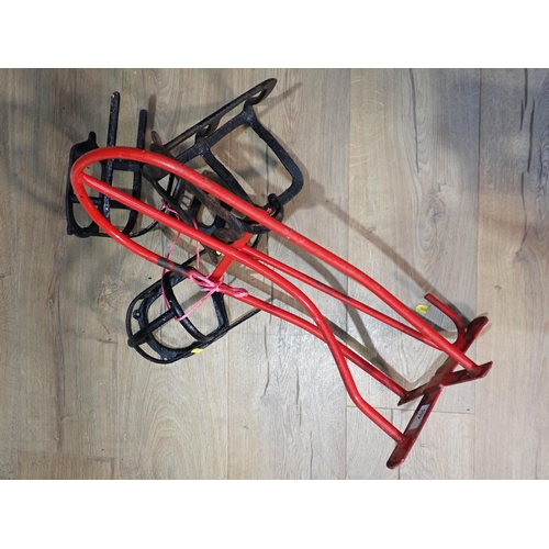 464 - A red painted metal Saddle Rack and four smaller black metal Tack Racks.