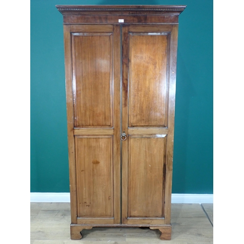 434 - A Georgian style walnut panelled two door Wardrobe mounted on ogee bracket feet 6ft 7in H x 3ft 3in ... 