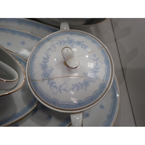 618 - A Noritake part Dinner Service with floral designs in blue glazes, some A/F