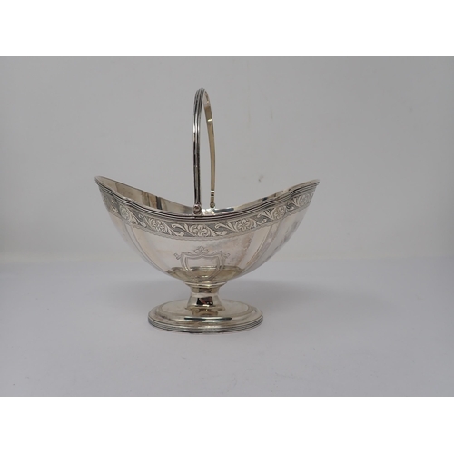 101 - An Edward VII silver shaped oval Basket with engraved frieze, vacant shield cartouches on pedestal b... 