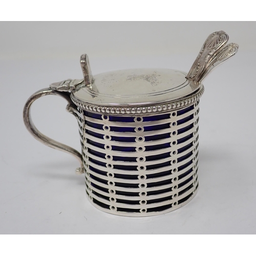 103 - An Edward VII silver pierced drum Mustard Pot with blue glass liner, London 1906, and two Spoons