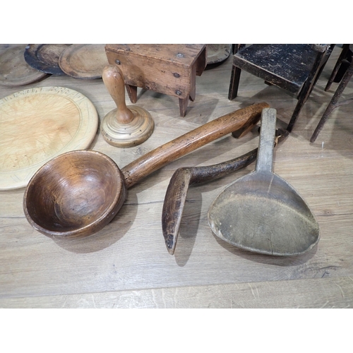 11 - A Doll's Kitchen Table and two Chairs, another Chair, various treen Bread Boards, treen Ladle, Teleg... 